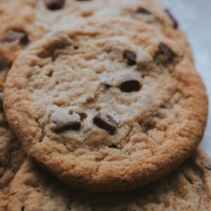 Warm, delicious chocolate chip cookies in a close-up shot, perfect for food enthusiasts.